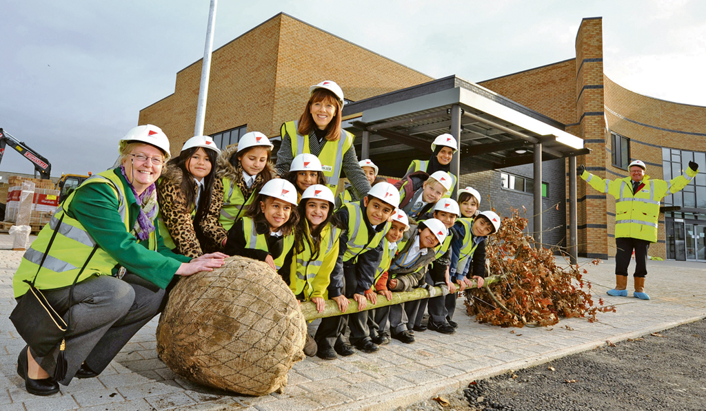 SCHOOL: Rainbow Primary School plant a tree marking the completion of their new building in Bradford, pictured with Deputy Lord Mayor Joanne Dodds