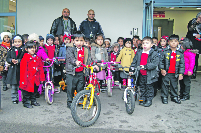 FREE: More than 25 children rode away on their new set of wheels, donated to the school by On Trak
