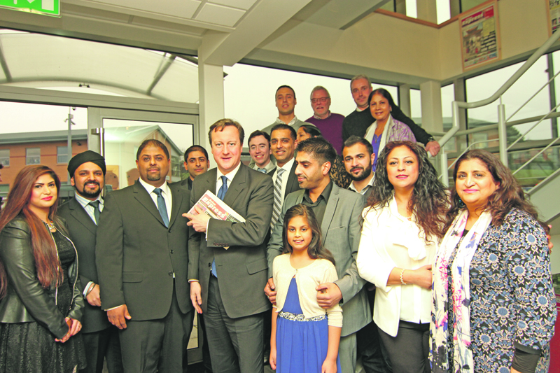 AN HONOUR: Team Asian Express delighted to have the Prime Minister David Cameron at their offices in Leeds. Asian Express Managing Director Nadim Hanif and Managing Editor Andleeb Hanif