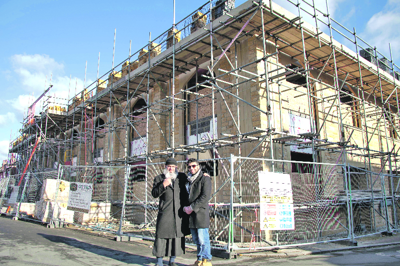 TEAM: Contractor and developer from Ontime Constructions, Aihtsham Rashid, stands with Masjid-e-Quba committee member, Mr Mir