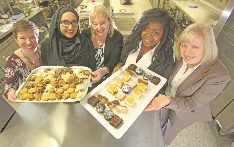 SIGNED UP: Students currently on work placements in the catering sector celebrate with Stafflex and Kirklees College staff, (l-r) Jude Flatley, KC Works project manager for Kirklees College; student Humairaa Ghazan; Maggie Netherwood Stafflex business development manager; student Mercy Dengure; Linda Kitson, HR manager for Polyframe
