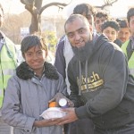 CHARITY: InTouch Foundation founder and board member, Osman Gondal, helped deliver meals to young and old in some of Pakistan’s slums