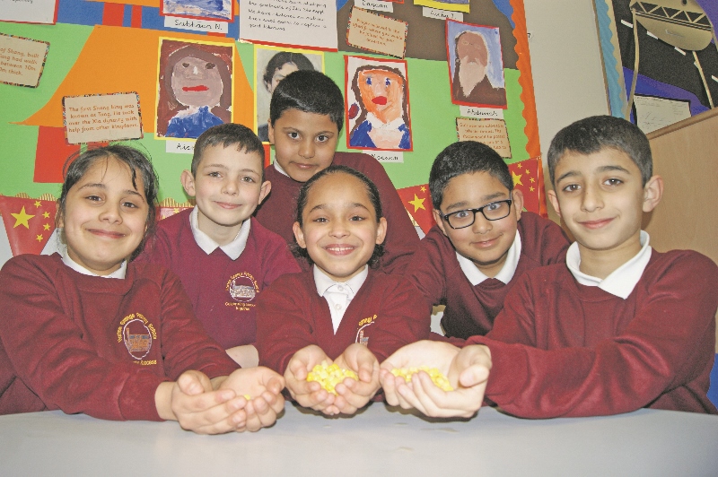 SWEET: Children from Year 4 smile with their flavoursome cup corn, Year 4 pupils pictured include: Owais Bostani, Liyla Khan, Ghazalah Darbok, Zaian Khan, Mustapha Khan and Zaian Wilkinson