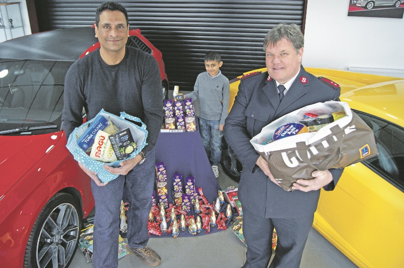 GIVING: Arshad Mahmood met with Salvation Army Captain, Wayne Price, after purchasing food parcels and setting up a foodbank