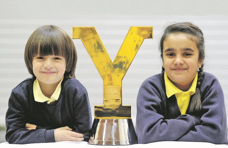TROPHY: Othmane Lamouri and Zahra Afzal from Brudenell Primary School got their hands on the Tour de Yorkshire trophy last week