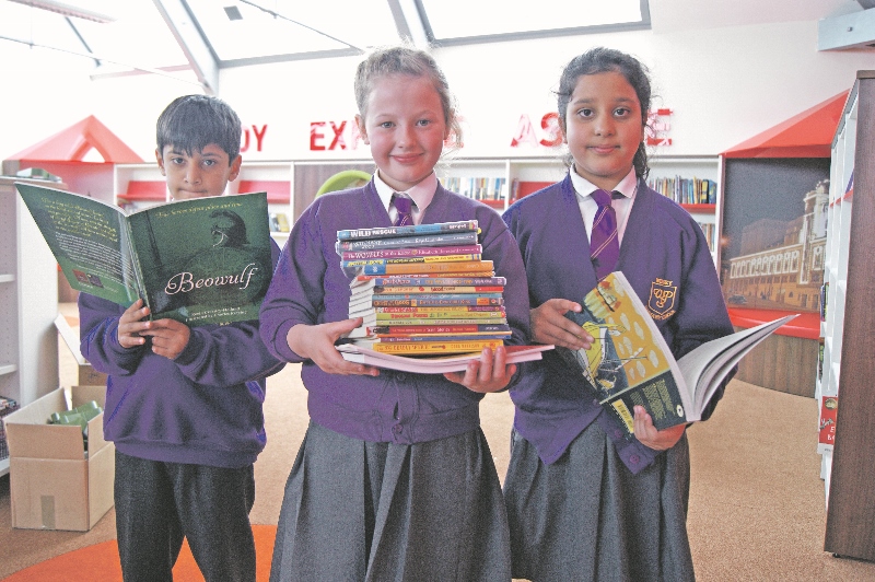 OPEN: Children at Wibsey Primary School got to see their new library facilities for the first time earlier this week (pictured, l-r) Suleiman Faisal, Laura Heaton and Afraha Ahmed