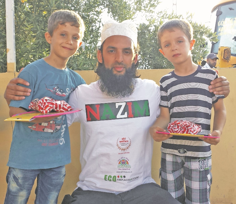 AID: As well as donating food parcels to Syrian refugees, Nazim Ali helped bring sweets and gifts to orphaned children at a local school