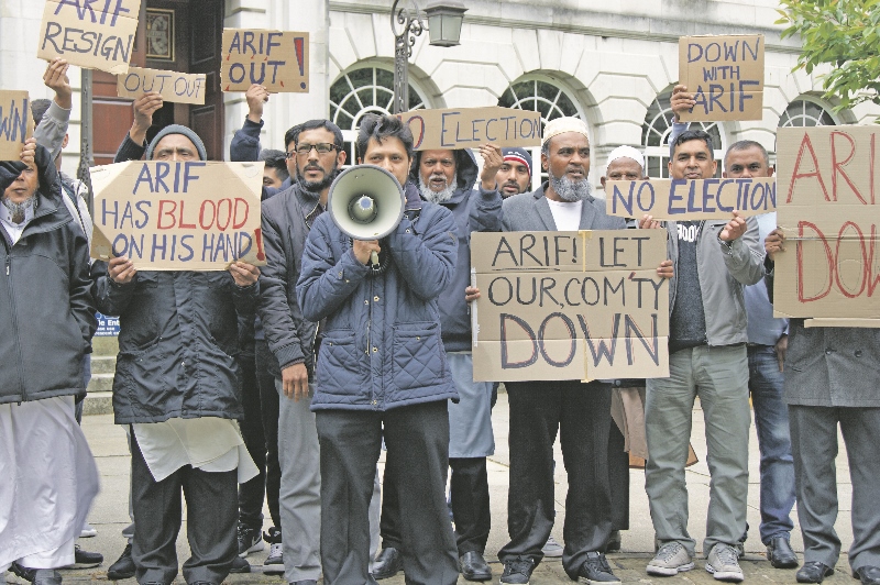 PROTEST: Campaigners gathered outside Leeds Civic Hall on Monday to call for the resignation of Councillor Arif Hussain