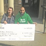 SUPPORT: Osman Gondal, founder and board member of the InTouch Foundation, says the charity relies on donations to continue the work they do, pictured receiving a cheque from Torque’s Louise Blamires