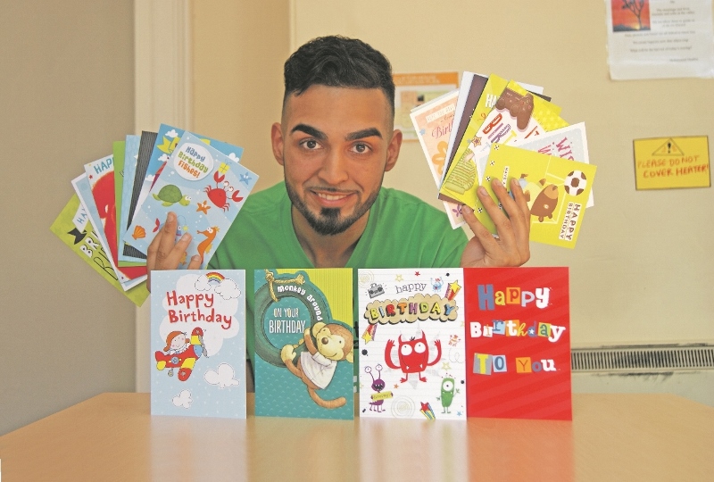 CARDS: Faisal Zakar, fundraising team member at the InTouch Foundation, shows just some of the cards already donated to the birthday card appeal
