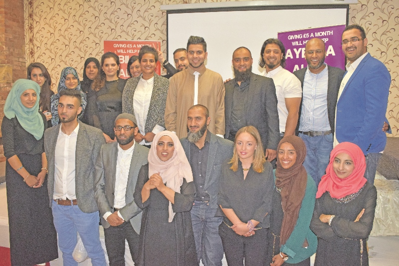 TEAM: The InTouch team celebrate after two highly successful Iftaars, pictured with singer Ahmad Hussain