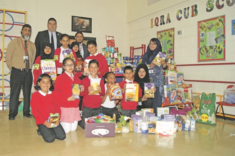 COLLECTION: Children, staff and governors from Iqra Academy show off their collection of food before it is distributed to the most disadvantaged in Bradford