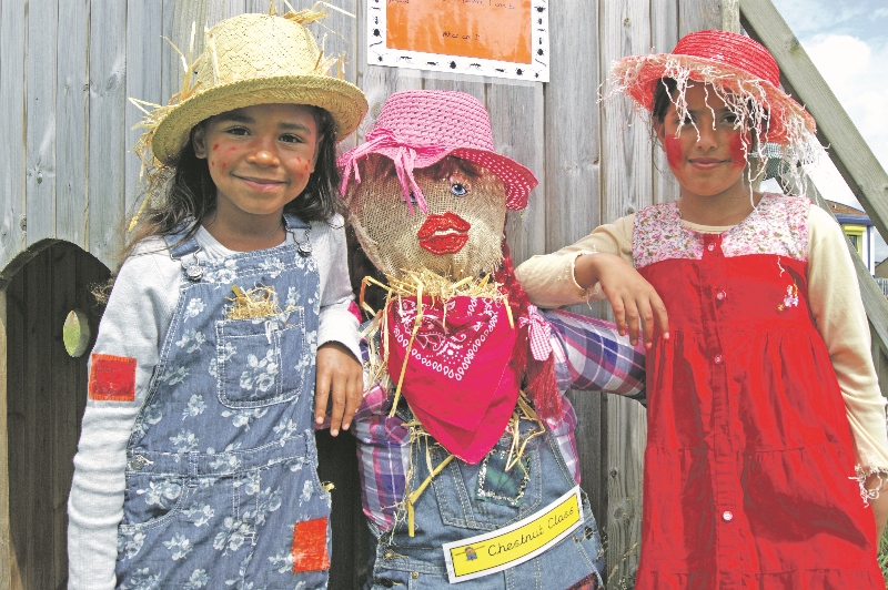FINISHED: Maisy and Hafsa show off their scarecrow called ‘Jessie’, designed by the Year 3 Chestnut Class