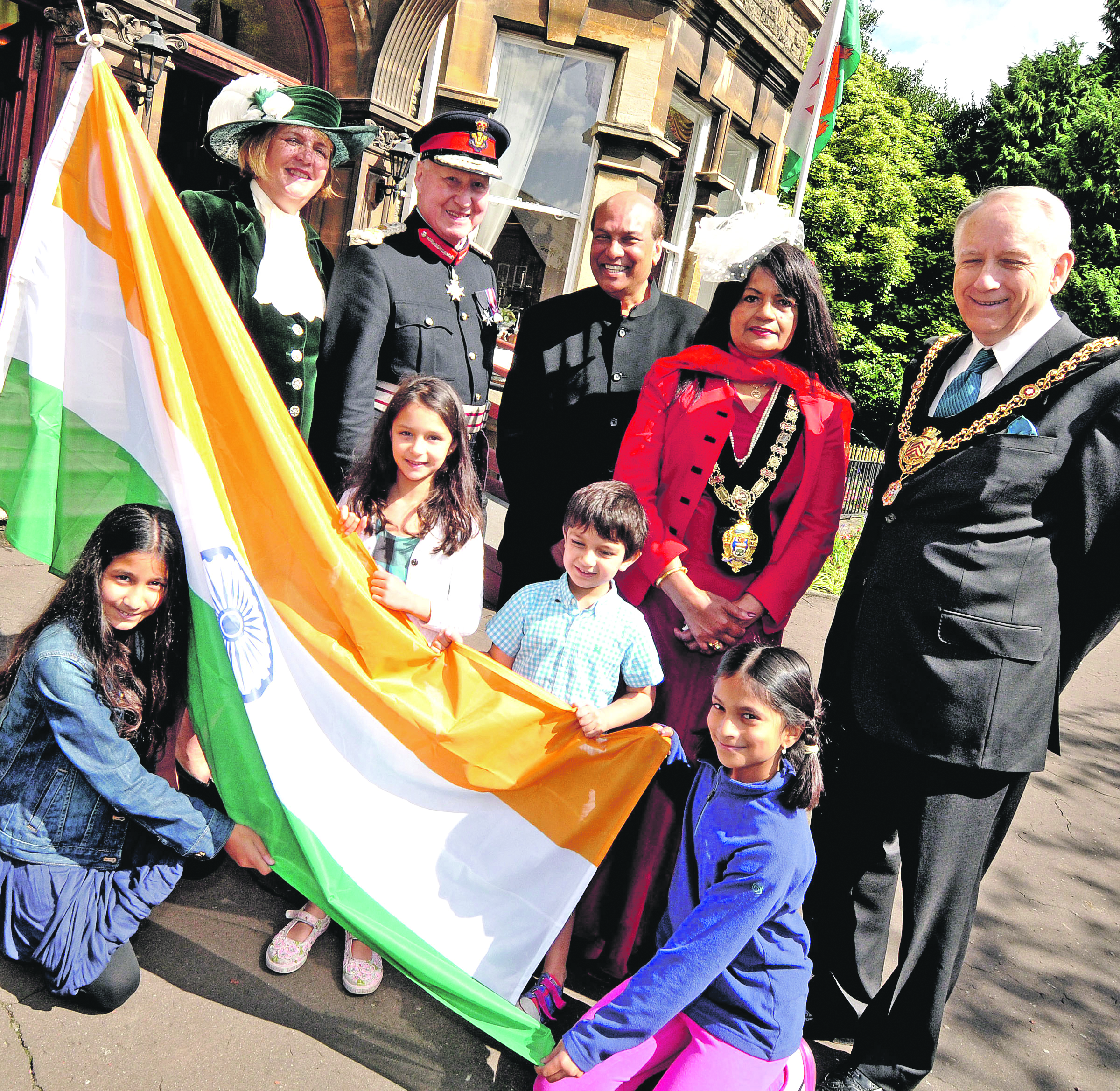 CELEBRATIONS: Marking Indian Independence Day in Wales with (L-R) High Sherriff Heather Stevens, Lord Lieutnant David Beck Hon consul Raj Aggarwal, Mayor of Colwyn Bay Dr. Sibani Roy and Lord Mayor of Cardiff with children