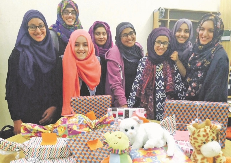 GIVING: Girls from the Dewsbury-based Kumon Y’all group distributed their Eid presents to children of all backgrounds and faiths at the LGI last week
