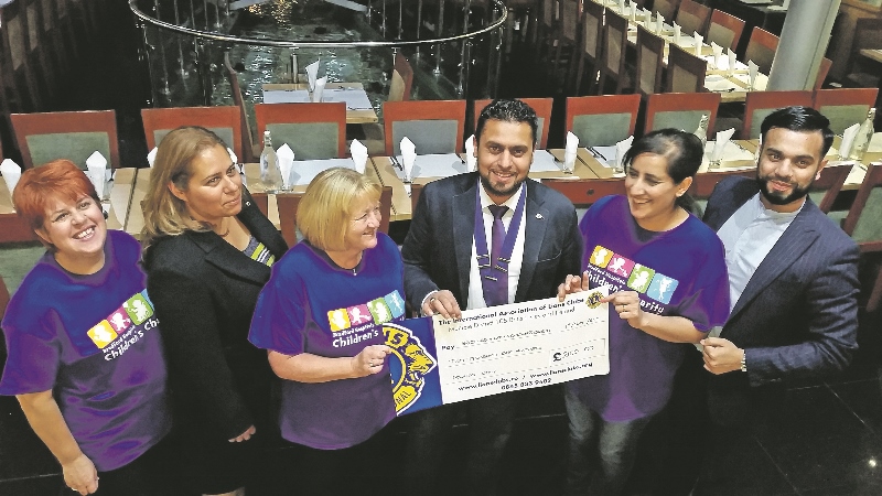 DONATION: President of Bradford Central Lions Club, Lion Mohammad Shahid, presents the cheque to Charity Fundraiser for the BRI’s Children’s Charity, Hayley Collis