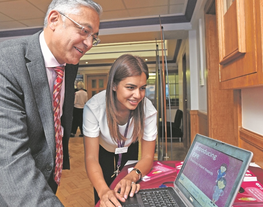 OPEN DAY: Chairman, Lord Kamlesh Patel of Bradford, hears how the hospitals' new electronic patient records (EPR) system will work when it goes live across the Foundation Trust in 2016 from EPR change manager, Sophia Khan.