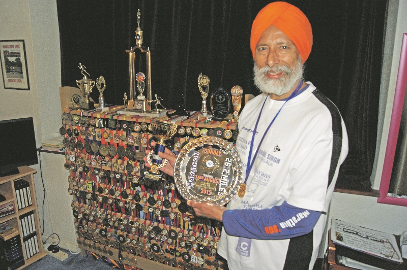 RUNNING: An impressive display of medals are on show at Joginder’s Bradford home