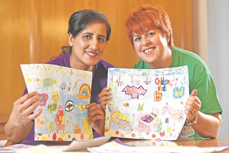 ARTY: Fundraising volunteers for Bradford Children’s Hospital, Naz Rafiq, and Hayley Collis, show off some of the artwork created by local primary school pupils
