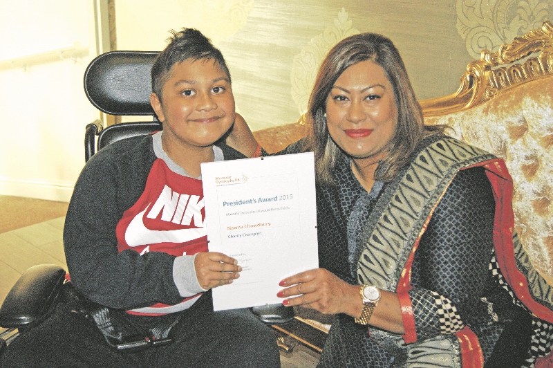 WINNER: Nazma Choudhry was awarded the Charity Champion President’s Award from Muscular Dystrophy UK, pictured with her son, Mahid
