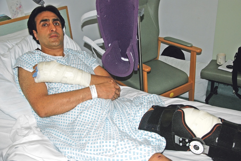 RECUPERATING: Nissar Hussain, 49, hospitalised with smashed knee-cap and broken arm