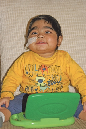 RECOVERING: Dawud is a happy, healthy baby once again and the family hope to have his feeding tube removed early next year