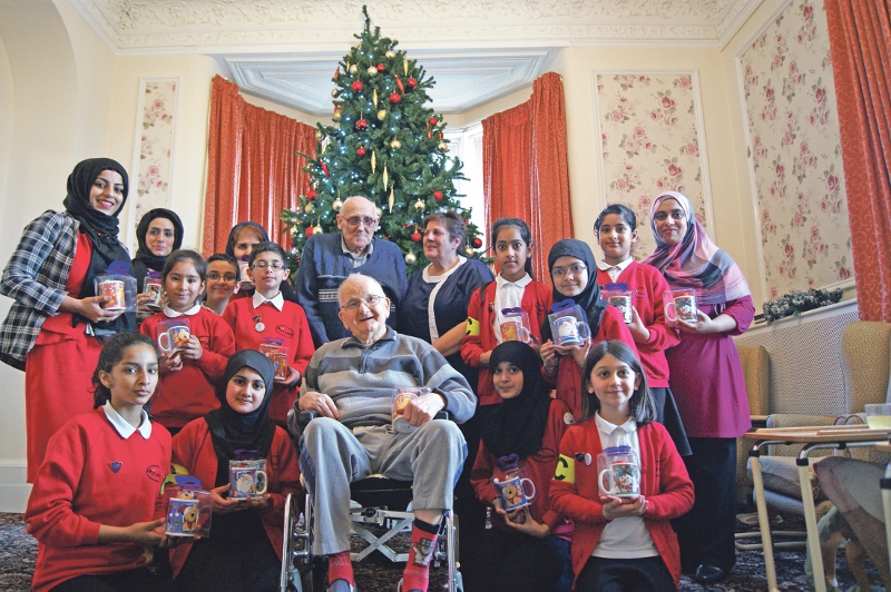 CHRISTMAS: Children from Iqra Academy handed out gifts to residents at The Mount Residential Home earlier this week