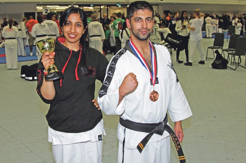 CHAMPIONS: Natasha Zafar holds her British Championship along Zeeshan and his Bronze medal