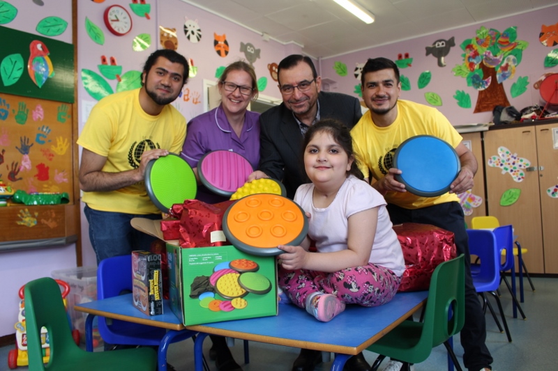 GENEROUS GIFTS: The Human Relief Foundation donated gifts to the Bradford Royal Infirmary on Thursday (clockwise, l-r) HRF’s Hasan Faridi, sister Ruth Tolley, HRF President Nabeel Ramadhani, HRF’s Muqaddus Khan and patient Malieka Azeem, aged six