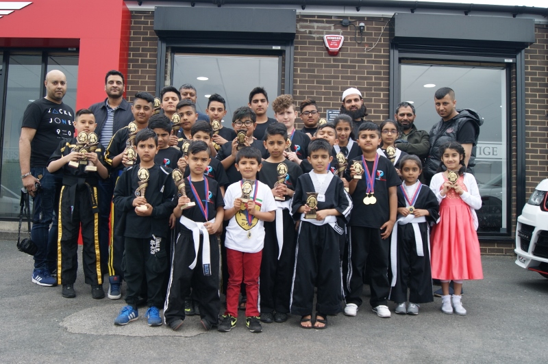 CHAMPIONS: The 2016 victors from the Azar Farouq Kickboxing Championships show off their accolades