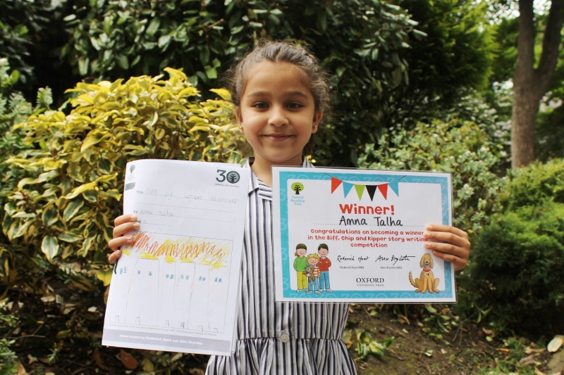 FIRE ON THE THAMES: Amna Talha is all smiles with her winning story for the Oxford Reading Tree’s 30th birthday competition’