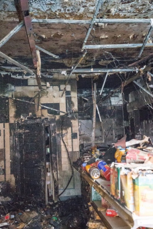 DESTROYED: The butchers was obliterated both inside and out, after the petrol bomb left the store badly fire damaged