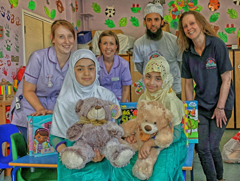 GIFT GIVING: The team delivered Eid gifts to children at the BRI last week, pictured: (back row, l-r) Nurses Emma Walker and Joanna Jacomb; W-Childcare Director, Nazim Ali; W-Childcare Manager, Michaela Yildiz (front row, l-r) Amina Qureshi, Zainab Qureshi