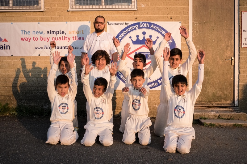 SPORTING DREAMS: Asim Saleem,CEO of Kashmir Crown Bakery, with members of successful Great Horton Church Cricket Club under 9s team supported by KCB