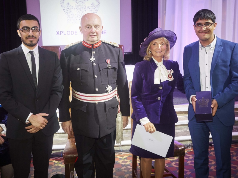VICTORIOUS VOLUNTEERS: The two young volunteers from Xplode magazine accept their Queen’s Award for Voluntary Service