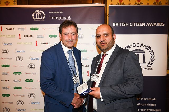 RECOGNITION: Mohammed Amran BCAc receiving his Medal from Pat Egan, Group Exec Director of Affordable Housing, Places for People