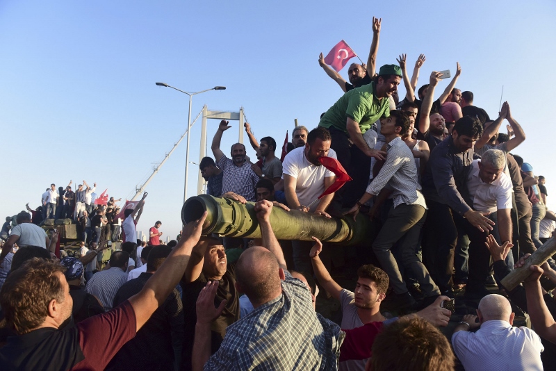 PEOPLE POWER: People climb on tanks in Turkey following the failed military coup