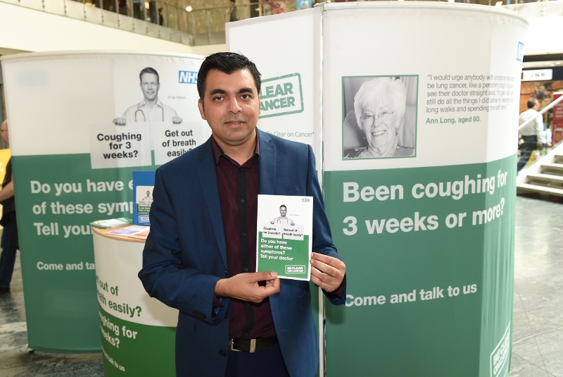 TALK TO YOUR GP: Khalid Ahmed, a pharmacist, warns Manchester shoppers about the early signs of cancer and heart disease