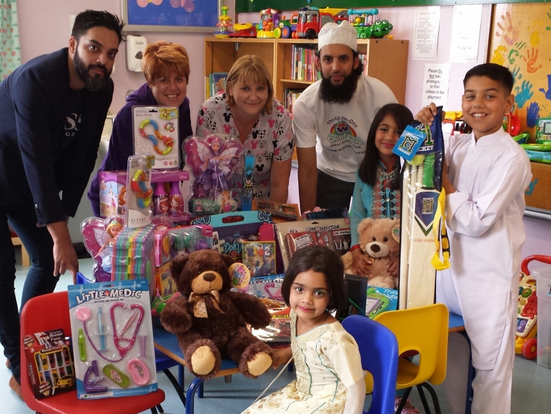 GIVING PROJECT: The generous team visited the BRI last week to deliver gifts, Pictured: front, Maryam Khan; Left-Right; Wajid Khan; Hayley Collis; Alison Kay; Nazim Ali; Safah Khan; and Monib Khan