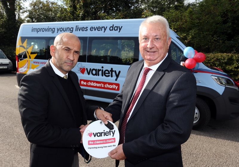 ON THE MOVE: Mahmood Mazhar hands over the keys to the new minibus to The Forest School headteacher, Peter Hewitt