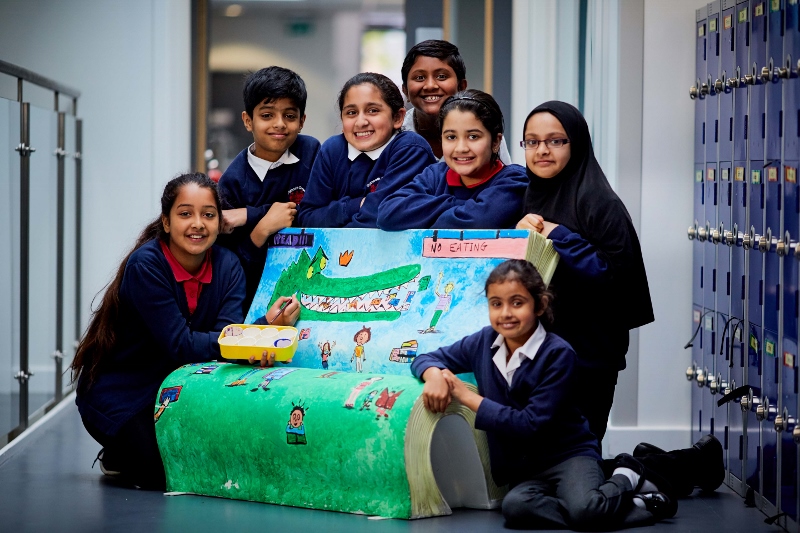 BOOKWORMS: Manchester kids with an imagination-sparking Bookbench they had designed (Pic cred: Mark Waugh)