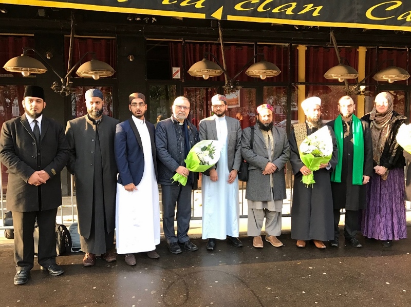 COMING TOGETHER: The delegation, organised by London Faiths Forum, laid flowers outside the Bataclan almost one year on from the Daesh attacks
