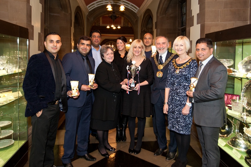 CURRY CAPITAL: The winning restaurateurs with Lord Mayor Geoff Reid and members of the ‘Visit Bradford’ tourism team