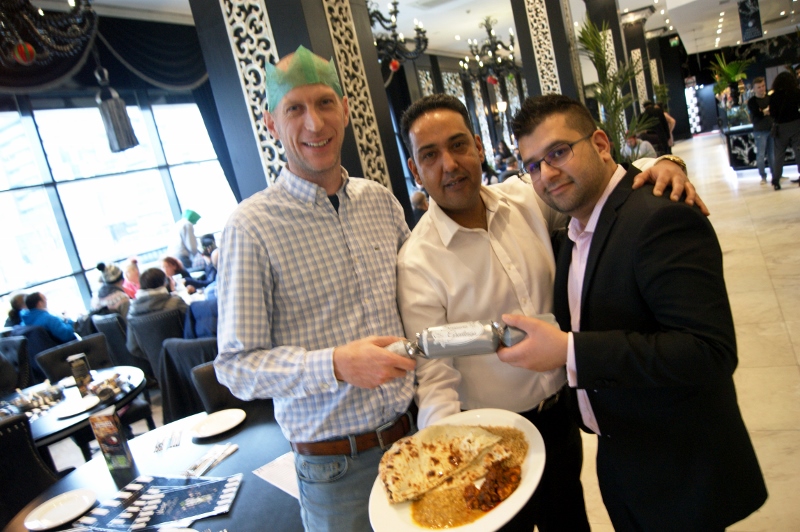 MERRY CHRISTMAS: (l-r) Sheltered housing resident, Stewart, Mumtaz Leeds owner, Rab Nawaz, and Just Give CEO, Sajed Mahmood, are all smiles at the festive feast for the homeless