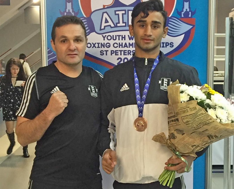 WORKING HARD: Akbar and his coach, Mally MacIver, travelled to Russia for the tournament with the England setup