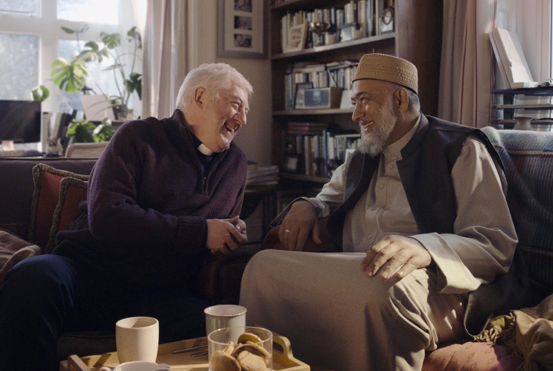 IT’S KNEEL-Y CHRISTMAS!: Zubeir Hassam and Rev. Gary Bradley are the two stars of Amazon’s Christmas ad this year