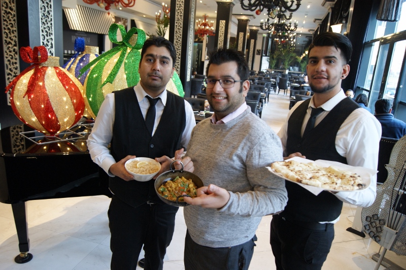 SERVING UP A TREAT: Sajeed Mahmood (centre), from the Just Give charity, is spearheading the project in conjunction with Mumtaz Leeds, and will help feed dozens of local homeless later this month