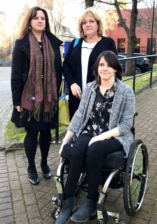 PARALYSED: Corisande Collins suffered severe spinal injuries after a horrific accident at a Wilko store in Lecicester. Pictured here outside Leicester Crown Court with mum, Suzanne Collins (R) and sister