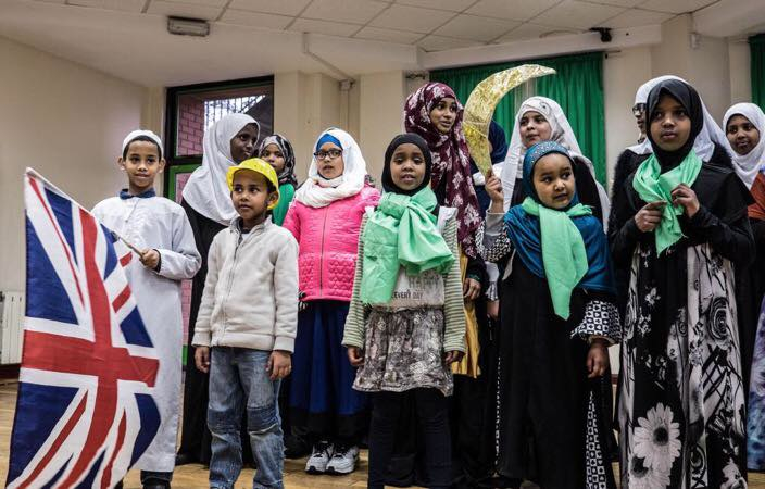 WARM WELCOME: Children greet their guests at Finsbury Park Mosque