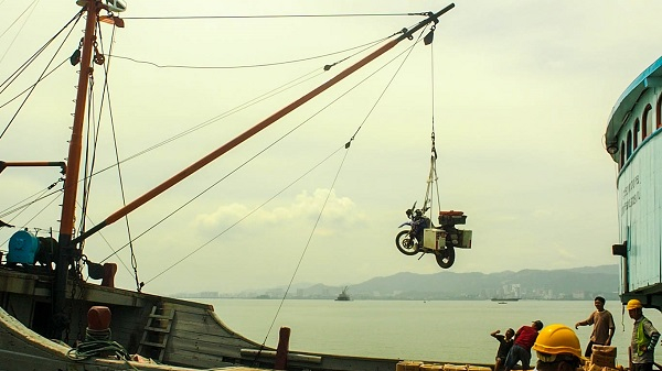 Transferring Jacho the super bike from the boat to the port in Malaysia